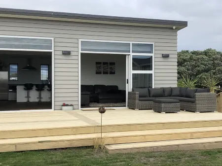 Brand New 3 Bedroom Beachfront Getaway.  Beach just across the road.