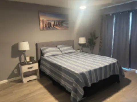 Beautiful Home in quiet neighborhood with a pool and close to stores & highways.