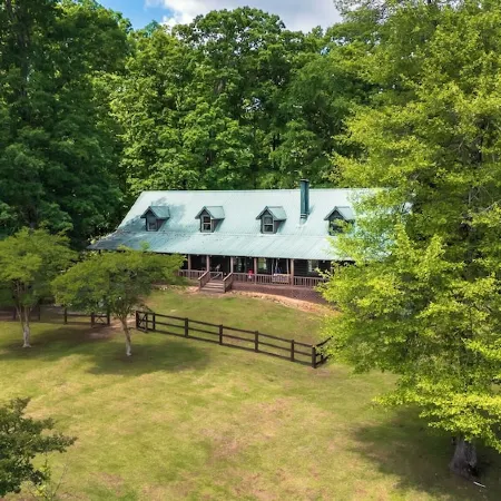 Cabin on 35 acres w/private lake for fishing, fenced yard, hot tub, pool table