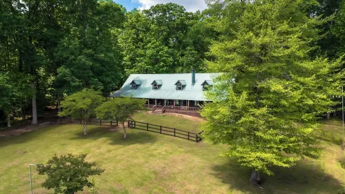 Cabin on 35 acres w/private lake for fishing, fenced yard, hot tub, pool table