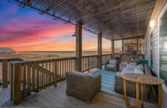 Luxury Beachfront Condo with Covered Deck Steps From Beach & Golf Cart Rental