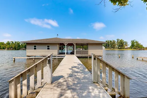 Relaxing Lakeside Retreat With Boathouse, Dock, Deck, Firepit and Screened Porch - 4-Star