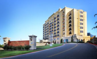 "a large yellow building with the words "" radisson "" written on it , located in a residential area" at Hotel Viata