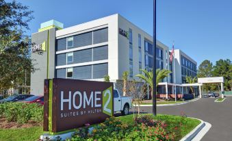 "a large white building with a sign that reads "" home 2 suites by hilton "" prominently displayed on the front of the building" at Home2 Suites by Hilton Richmond Hill Savannah I 95