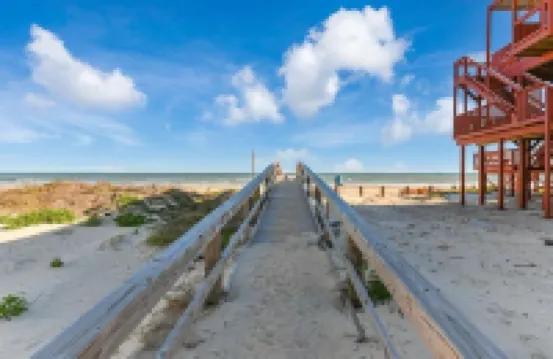 Luxury Beachfront Condo with Covered Deck Steps From Beach & Golf Cart Rental