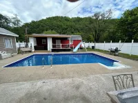 River Road Retreat.  Cabin minutes away from trails w/ hottub & seasonal pool!