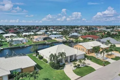 RUM CAY GETAWAY: South facing waterfront home, private pool/spa, bar, and dock.