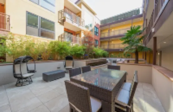 Bright & Sunny Top Floor • ADA Elevator • Walk Downtown • Garage • in-unit W/D