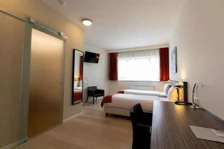 Hotel Taormina Brussels Airport Отели в г. Кортенберг