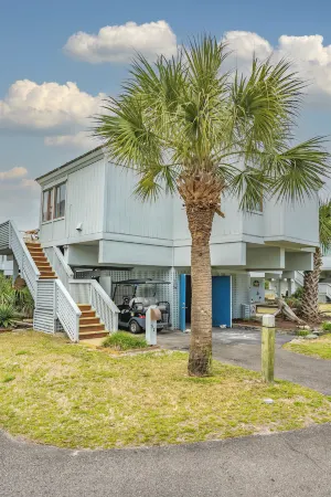 Walk to the beach or pool in this cozy villa. 2 deck spaces with 2 golf carts for enjoyment