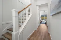 BRAND NEW 4-bedroom, 2 primary suites, heated pool, steps to the beach and river