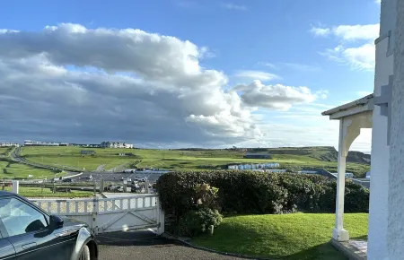 Pendragon House Overlooks Crooklets Beach in Bude with parking for 5 cars.
