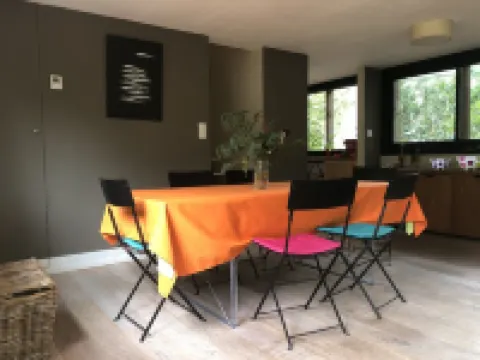 Wooden house in the golf, between forest, lake and ocean