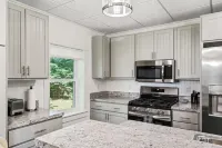 Charming 4-bedroom farmhouse with AC and WiFi in delightful Charlevoix Hotels in Marion Township