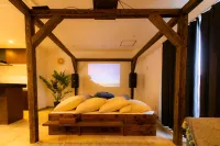 Roof Balcony with BBQ and Jacuzzi Projector Equi Hotels in Nakijin