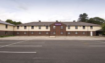 "a large brick building with a sign that says "" hitec "" is shown in the background" at Premier Inn Caerphilly (Corbetts Lane)