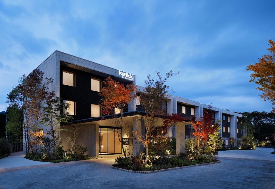 "a modern hotel building with a large glass window and the name "" novotel "" displayed on the building" at Fairfield by Marriott Tochigi Utsunomiya