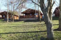 Lakeside Log Cabin with hot tub overlooking the water.