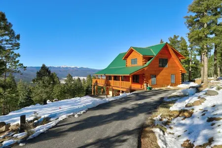 Incredible Views! Stunning log home w/ wrap around deck and covered porch