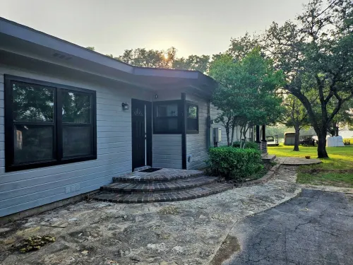 Newly Renovated 1.5 Acre Lake Front Home with Game Room and Direct Lake Access.