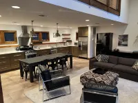 Stunning and private mid-century modern inspired cottage nestled in the woods.