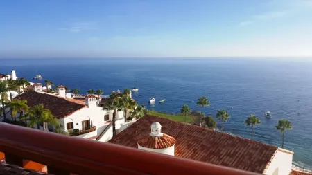 MAGNIFICENT OCEAN VIEW Hamilton Cove Condo With Golf Cart Included.