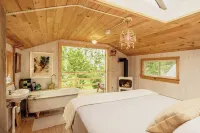 Treehouse lifted up over a stocked trout pond up in the beautiful birch trees!