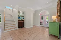 Waterfront Pink House with Private Dock & Pool - 4-Star