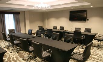 a conference room with several chairs arranged in a semicircle around a long table at Homewood Suites by Hilton Allentown Bethlehem Center Valley