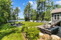 Family Friendly lake home, beach, level lot, fire pit, game room, dog friendly!