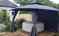 Riverside village hideaway with hot tub