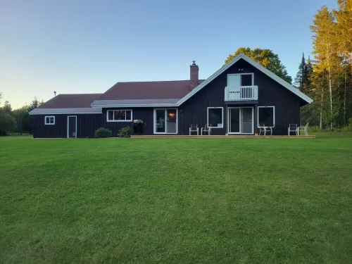Remodeled lodge on 73 acres with 1/2 mile riverfront in Michigan's UP wilderness
