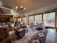 Walk to ski & trails! Luxury lodge, sleeps 17, hot tub, fire pit & fenced yard.