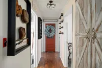 Cabin rental with Hot Tub, Fire Pit, mini fountain pond, hammocks, corn hole.