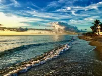 Located steps from the ocean, offering true beach living.