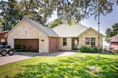 Bright, open concept, lakefront house on open water with amazing sunset views!