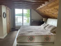Relax in Raymond's lakefront 2-bedroom vacation home, just steps to Sebago Lake