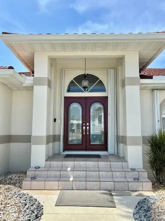 MAGNIFICENT! LUXURY WATERFRONT HOME;BIG HEATED POOL-80’ DOCK! 5 MIN FISH VILLAGE