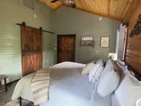 The Cozy Pines is a newly built, romantic log cabin with a 2-sided fireplace.