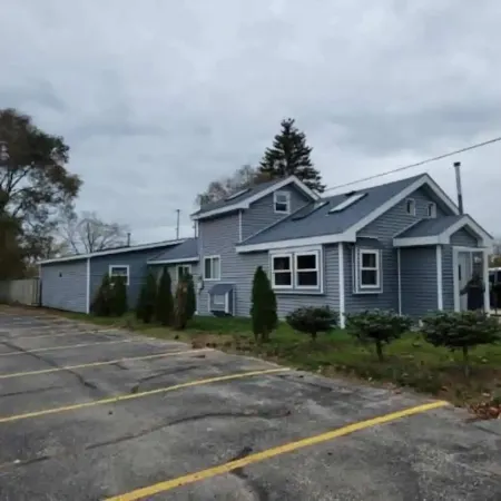 Cabin in Oscoda with hot tub and game room