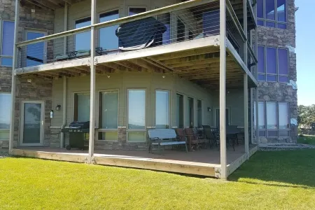 Prime Lakefront East Okoboji Condo at Bridges Bay Jet Ski Lift rental available!