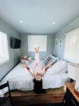 Tiny house on an acre with ocean view and private infinity pool.