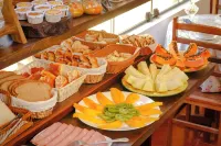 Velinn Pousada Recanto da Natureza - servizio colazione