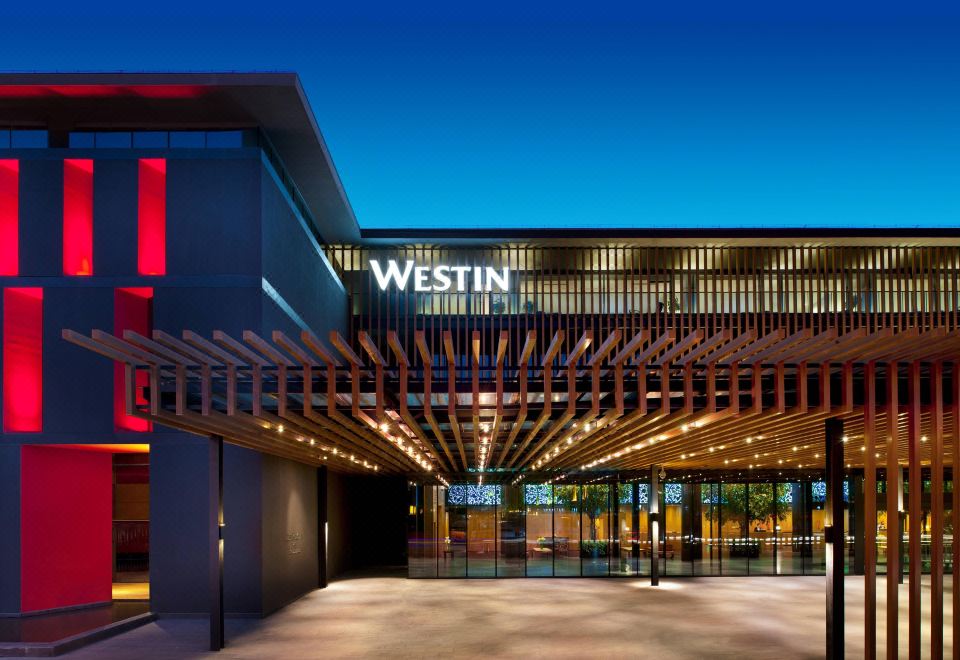 A photo of a building's front entrance taken at night at the Westin Xi'an