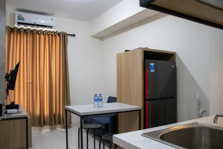 Comfort 2BR at 28th Floor Podomoro Golf View Apartment By Travelio