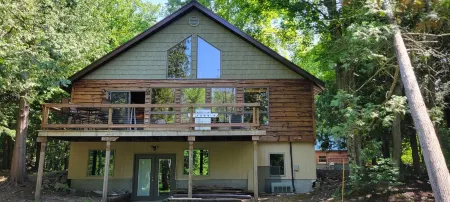 Newly Remodeled Beautiful Betsie River Home 500'WaterfrontSki Fish Explore