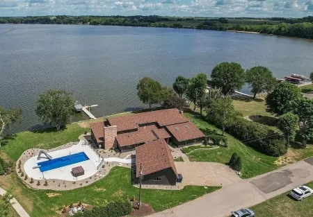 Paradise Found! Beautiful Lake Home with Private Heated Pool on Cannon Lake!