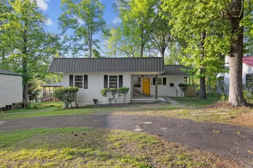 Newly Renovated Lakefront home with boat house, launch and 2 piers!