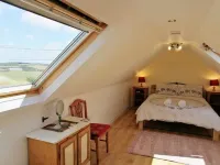 Honeysuckle Cottage with optional hot tub and shared EV charger.