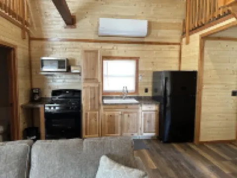 White cabin in the woods close to Univ. of Central Missouri and Whiteman AF Base
